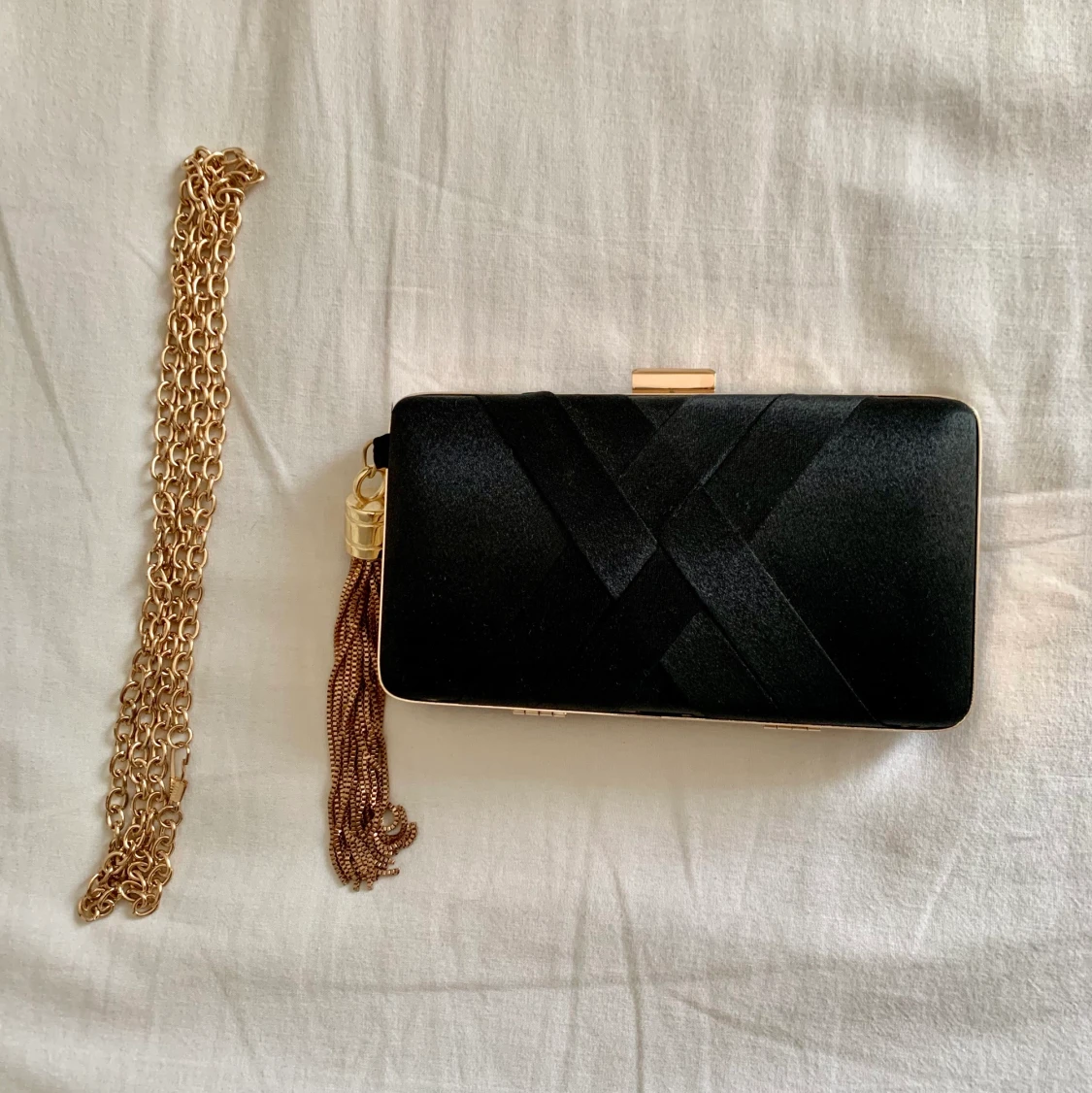 Svart/guld clutch väska