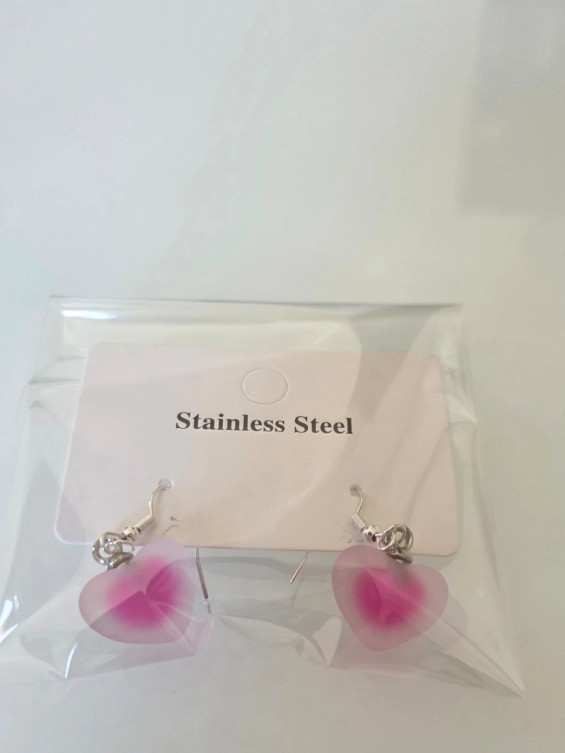 Rosa hjärtformade örhängen i stål - 1