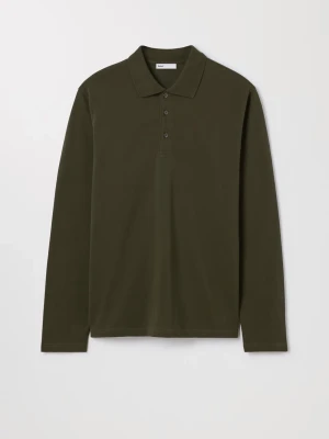 Mörkgrön långärmad pikéskjorta - Stilren mörkgrön långärmad pikéskjorta med klassisk kr input och knappar framtill. Tillverkad i mjuk bomull som soppar både komfort och enkel stil. Perfekt för dig som gillar en clean look. Helt ny med prislapp kvar!