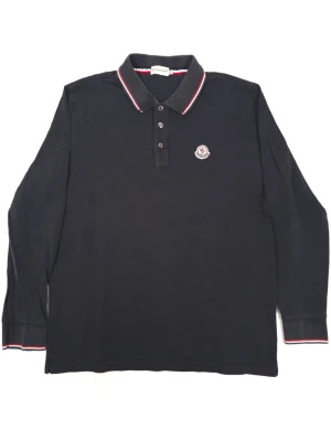 Moncler Longsleeve Polo Shirt Navy - •The Polo has been gently used and is in good condition • Size: XXL Fits L •Color: Navy • Retail price: 3900Sek •Pit to Pit: 54cm Length: 69cm 