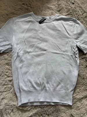 Ljusblå stickad topp från H&M - Aldrig använt ❤️ungefär ( XXS-XS)