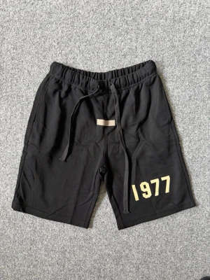 1977 Essentials black shorts - Size M, true to size. Unused, brand new and fresh. Please feel free to ask questions.