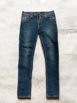Nudie Jean Lean Dean  - Tjena säljer denna jätte snygga och knappt använda nudie jeansen i Lean Dean modell i storleken W32 L34. Jeansen har en tvär snygg fade och design. Skriv gärna vid intresse! 