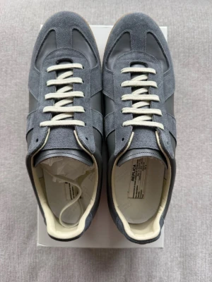 Maison margiela gats (Gray/44) - Great condition, never worn. Comes with the box and dust bags. Same day shipping. Mystery present included. Feel free to ask questions.