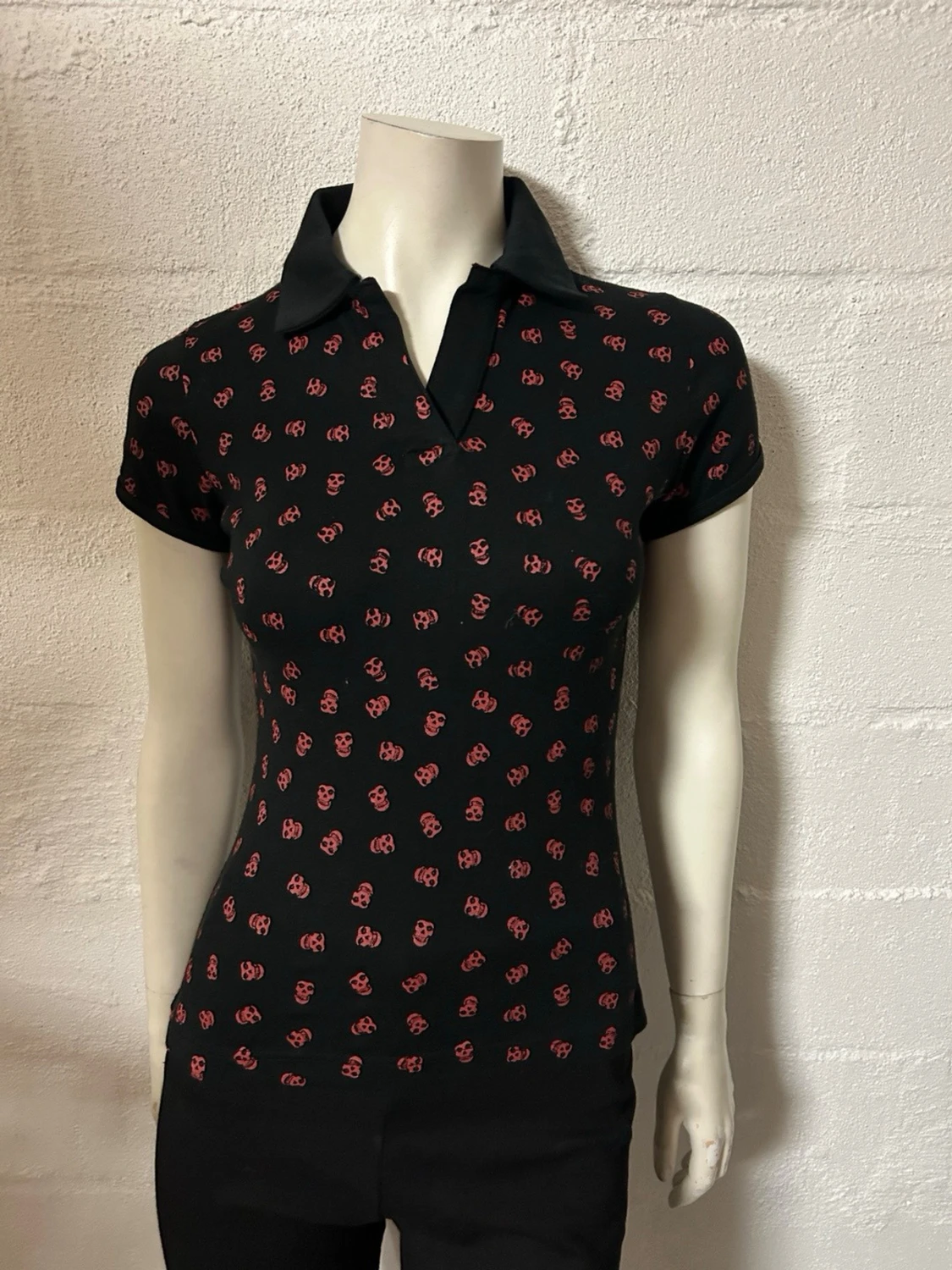 Topp med krage i storlek S/M från Poizen.