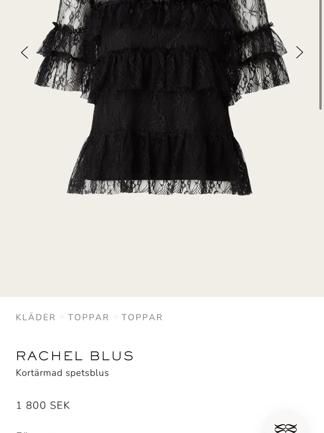 Svart spetsblus med volanger