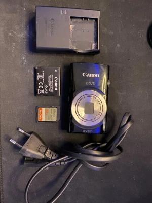 Canon IXUS 185 - Endast kontant pga strul med bank id.                     Möts upp i Stockholm-Barkarby.                             Pris kan diskuteras vid snabb affär.                                                            Canon IXUS 185 i bra skick. Har använts få gånger och har inga bilder/vidios på sig. Medföljer laddare, batteri, SD-kort(32gb) och laddkabel. Perfekt för dig som vill ha en enkel och portabel kamera.                    SKICKAS EJ!!!!