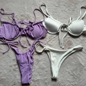 Ljuslila och vit bikini med knytning - Läs igenom hela annonsen innan ni budar, tack! Två bikinis säljes, en ljuslila och en vit. Båda har bygel-bh med knytning framtill för lösare/tightare look och axelband som går att justera samt matchande bikinitrosor med knytning i sidorna på den lila modellen. Den vita bikinin är ribbad och den lila är slät. Båda är oanvända för att storleken är fel på mig, underdelarna är small och överdelarna är ca 75B-70C. Perfekta för sommaren! Säljs separat eller tillsammans💜
