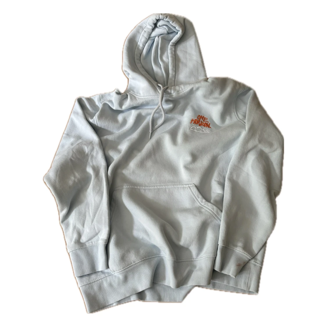 Ljusblå hoodie från H&M med tryck