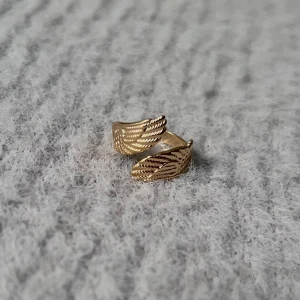 Golden Wings - Justerbar. Rostfri 