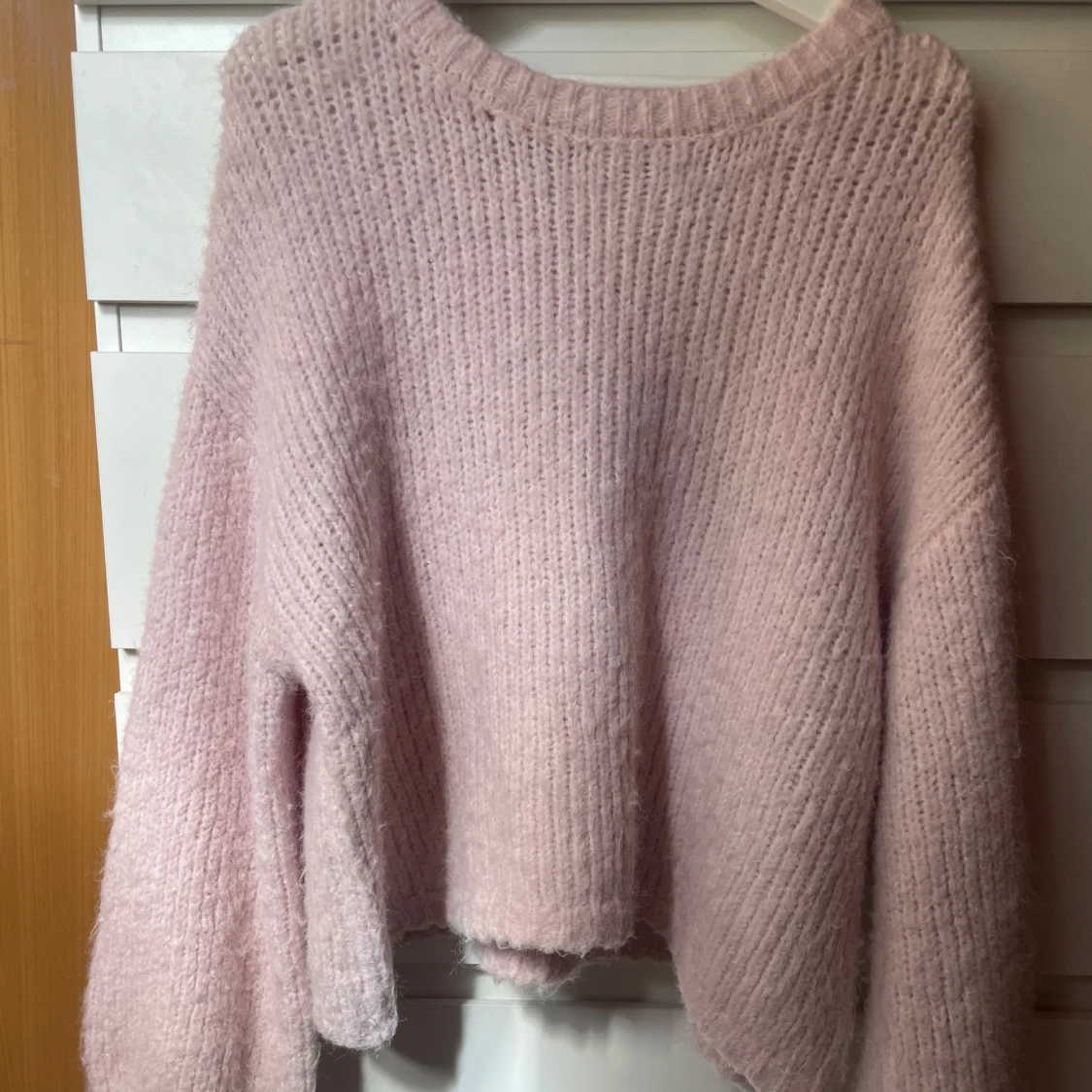 Ljusrosa stickad tröja