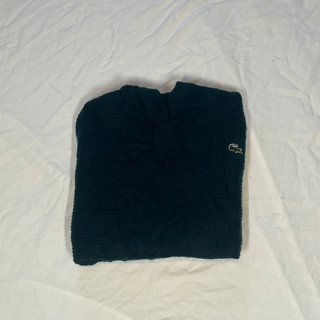 Mörkgrön stickad tröja från Lacoste