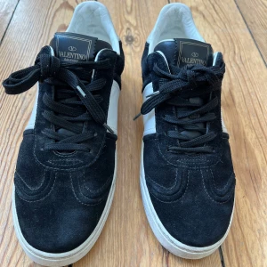 Valentino Flycrew sneakers - Black Valentino Flycrews in very good condition, size 38 but fits up to size 39. All ‘nitar’ are still present. Only slightly worn on the inside as shown on the picture. Comes in original Valentino shoe box and spare pair of laces.