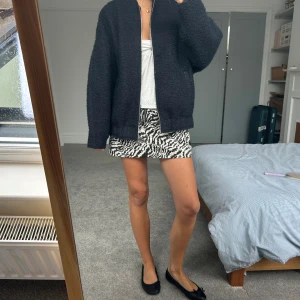 Zebra print mini skirt  - Topshop skirt size UK10. Rolled over to make low rise. Good condition. Shipping from England, takes 10 days to arrive, shipping included in price 