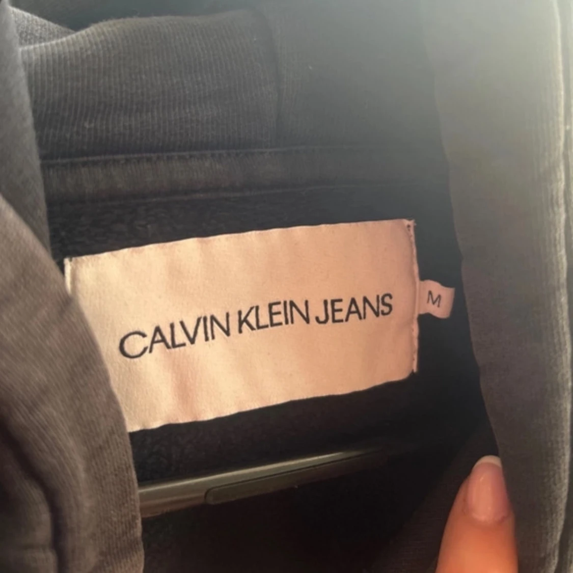 Svart hoodie från Calvin Klein Jeans - 1