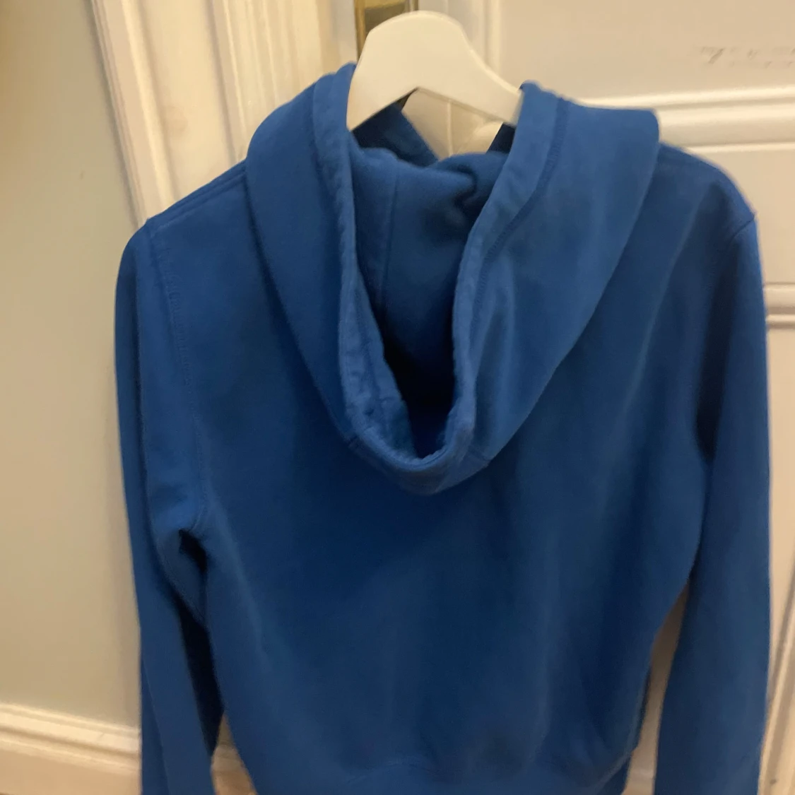 Blå hoodie från Tommy Hilfiger - 1