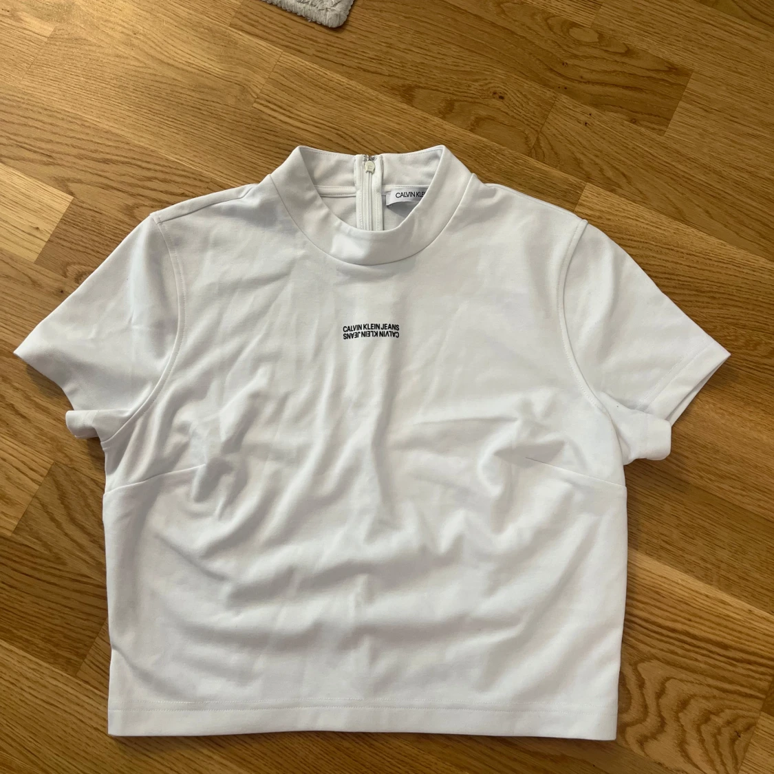 Vit polotopp från Calvin Klein Jeans