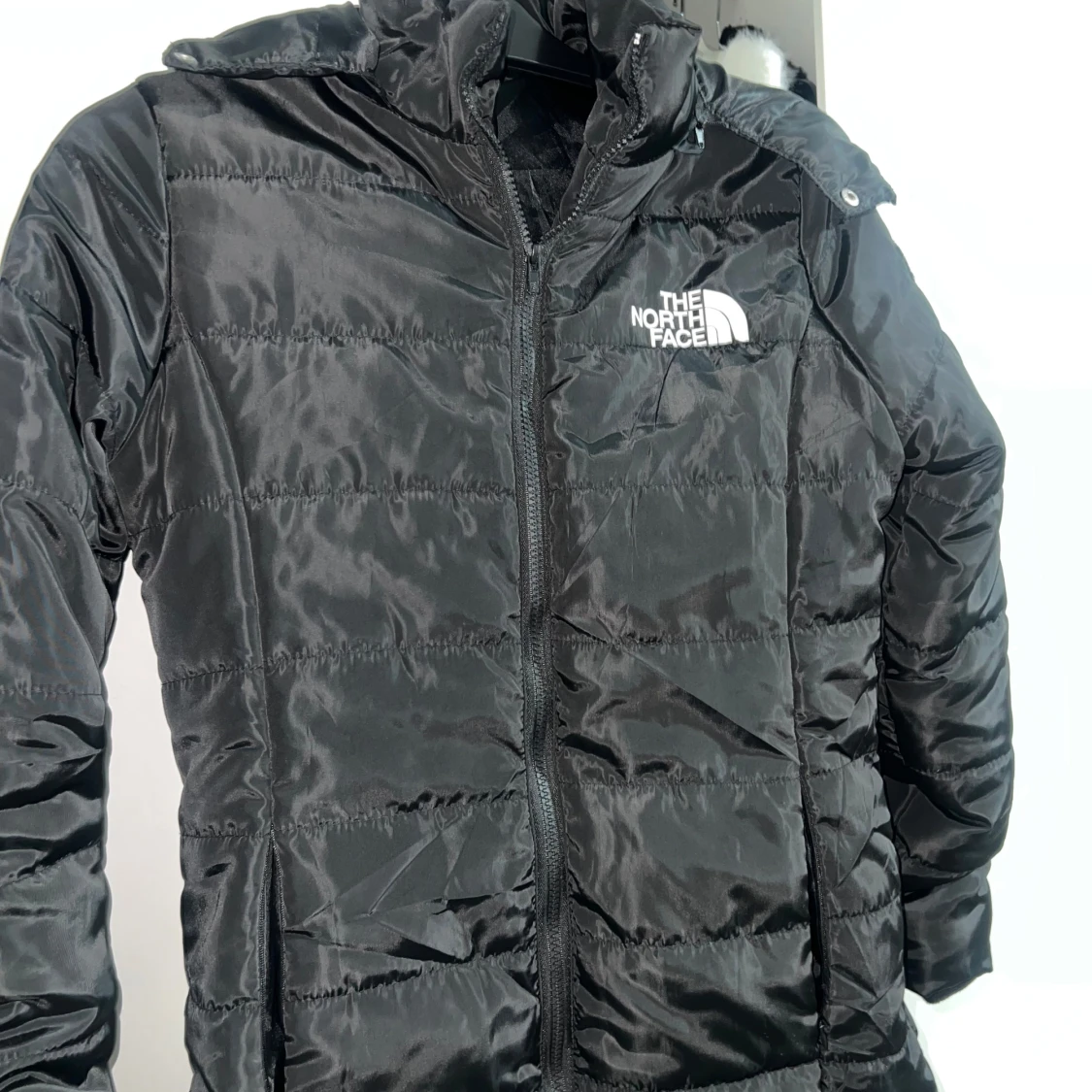 Svart dunjacka från The North Face