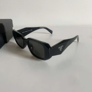 Prada Sunglasses - Unisex | Brand New & Unworn - Elevate your style with these stunning, brand new Prada sunglasses! Timeless design meets modern elegance, perfect for any occasion. Grab them now and make a statement!