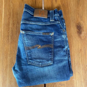 Nudie Jeans - Jeans from Nudie Jeans. No sign of use or wear other than the fixed hole in the crotch. They fit very well and are size 31/32. (Also fits bigger.)