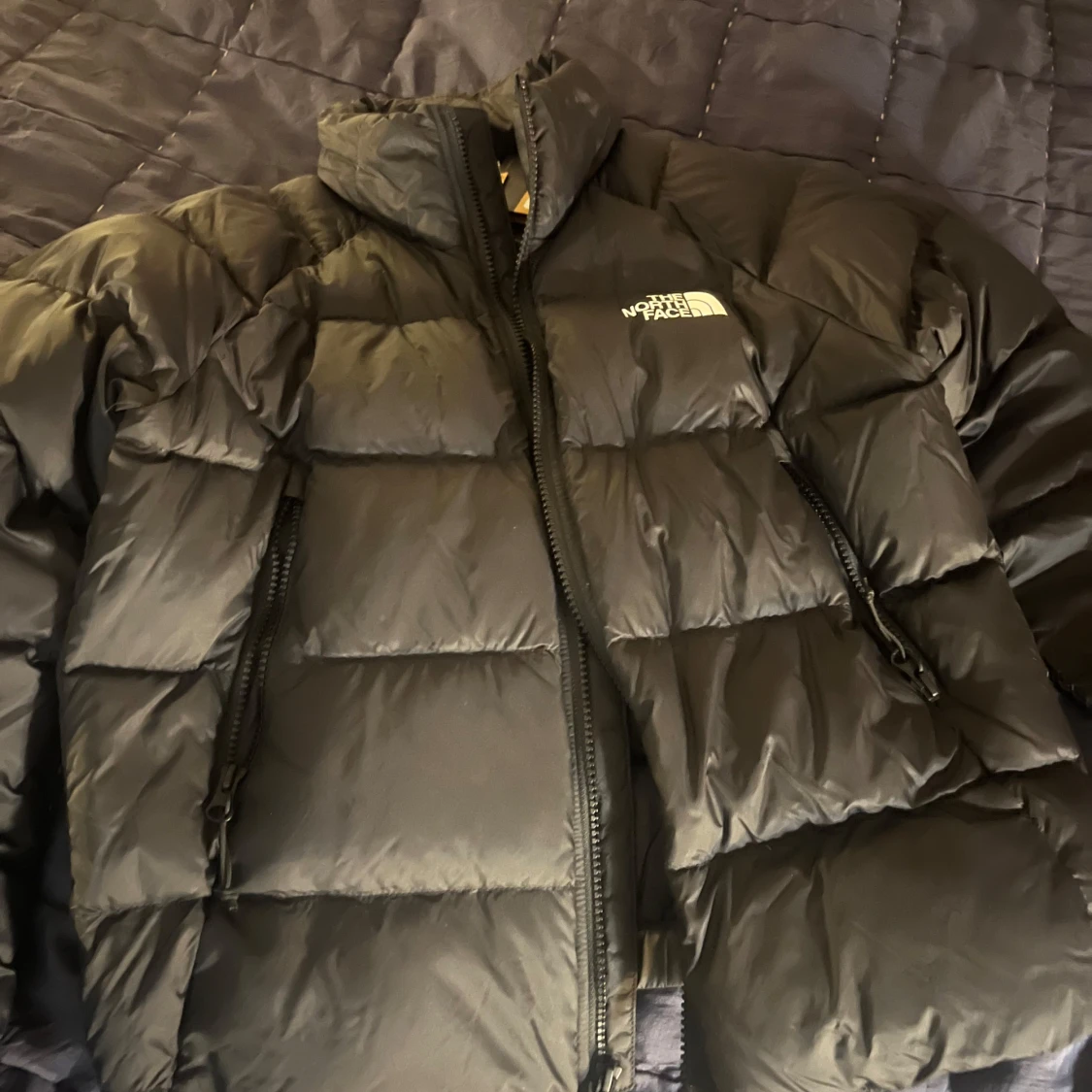 Svart dunjacka från The North Face