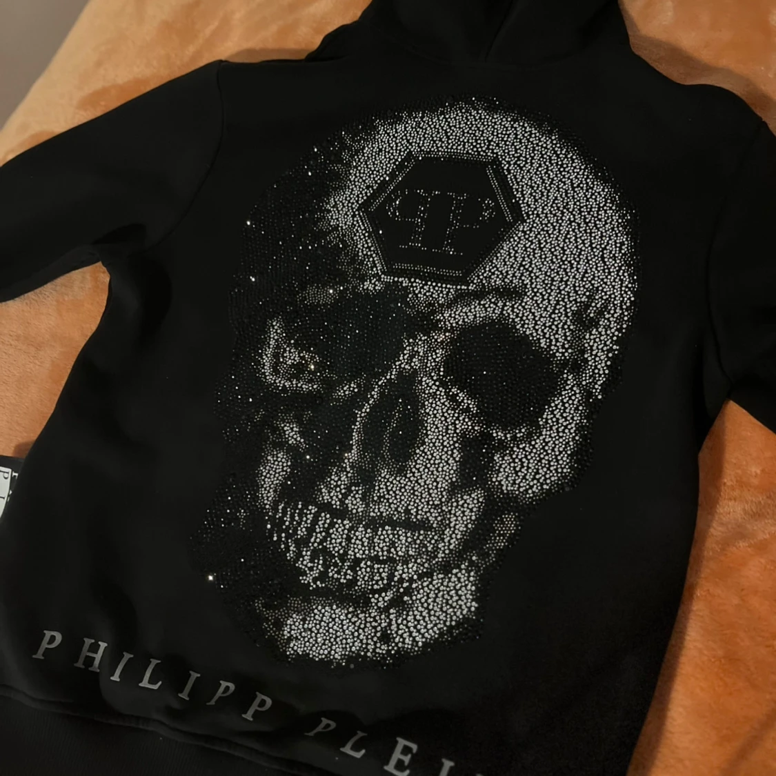 Äkta svart hoodie med dödskalle från Philipp Plein