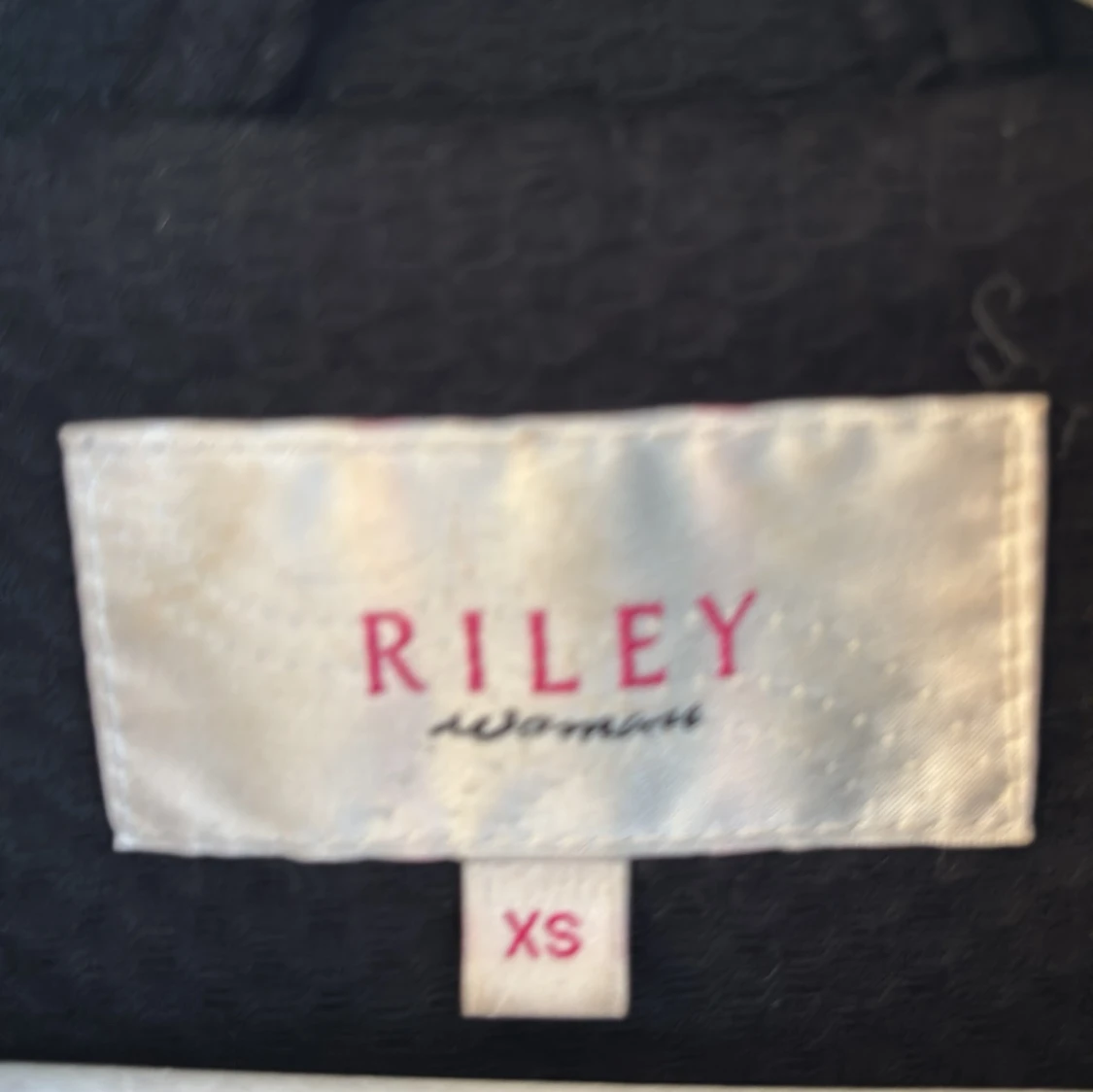 Svart kappa från Riley - 2