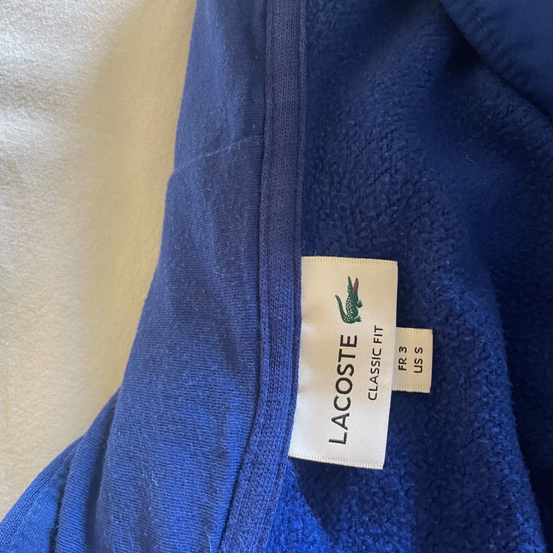 Blå hoodie från Lacoste - 2