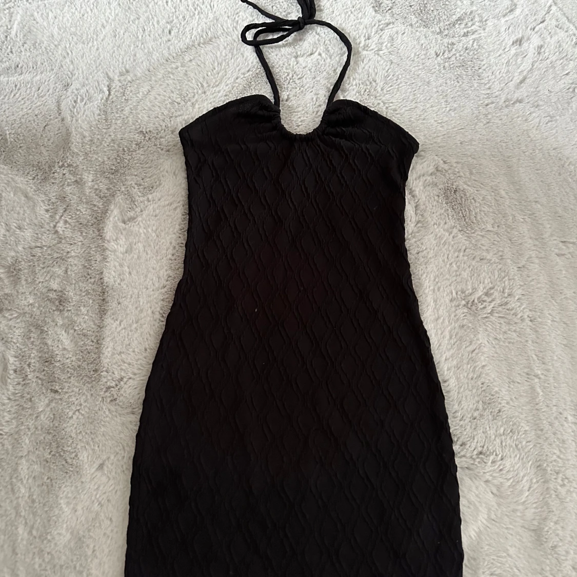 Svart halterneck klänning