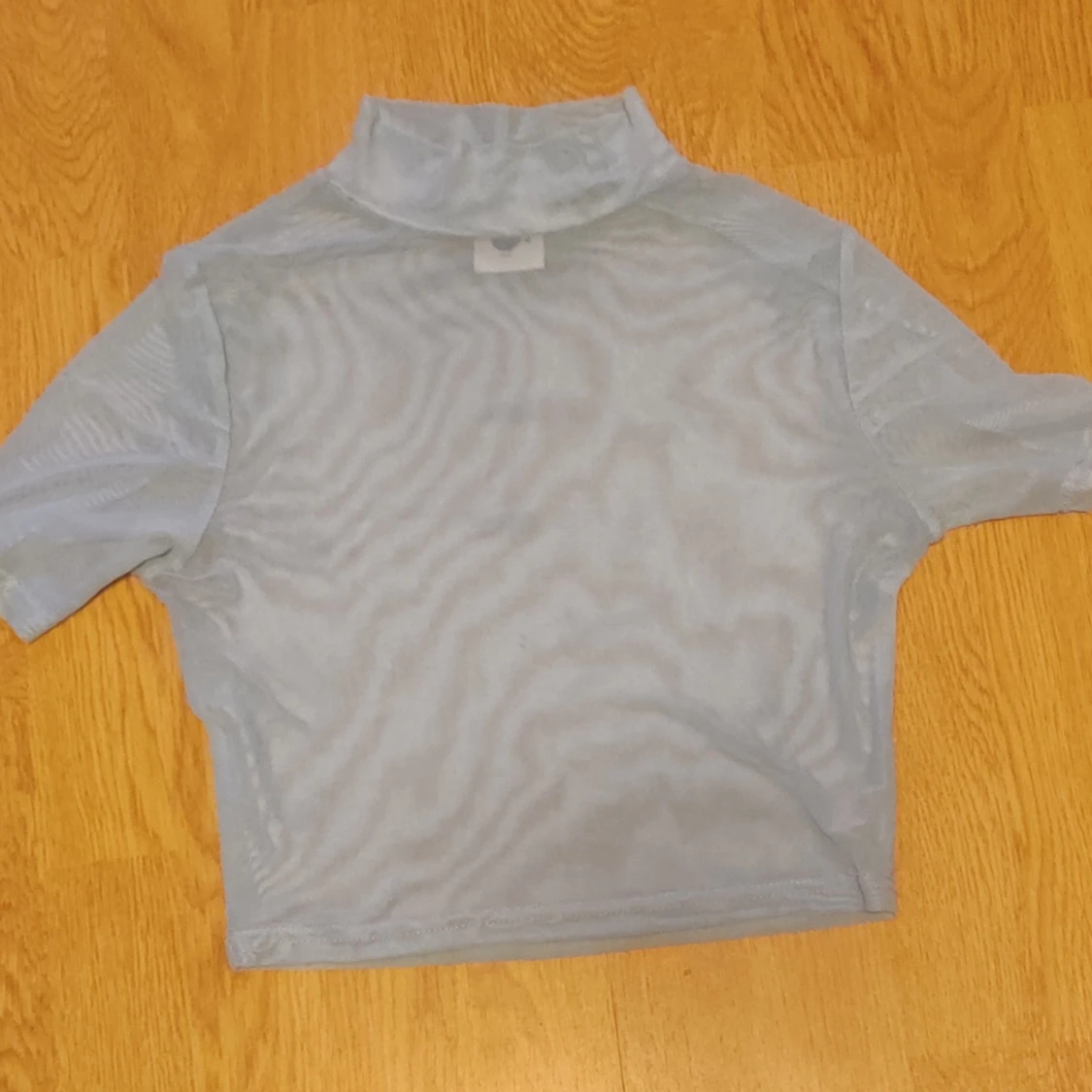 Ljusblå mesh polotopp - 90