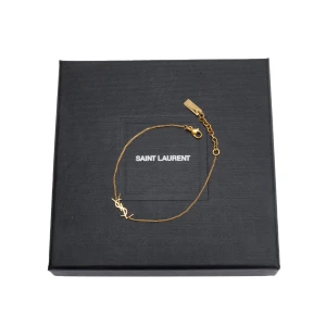 YSL ARMBAND - Armband från YSL (Saint laurent) i storlek small, aldrig använt. Nypris ca 4000kr. Kvitto, box osv finns!