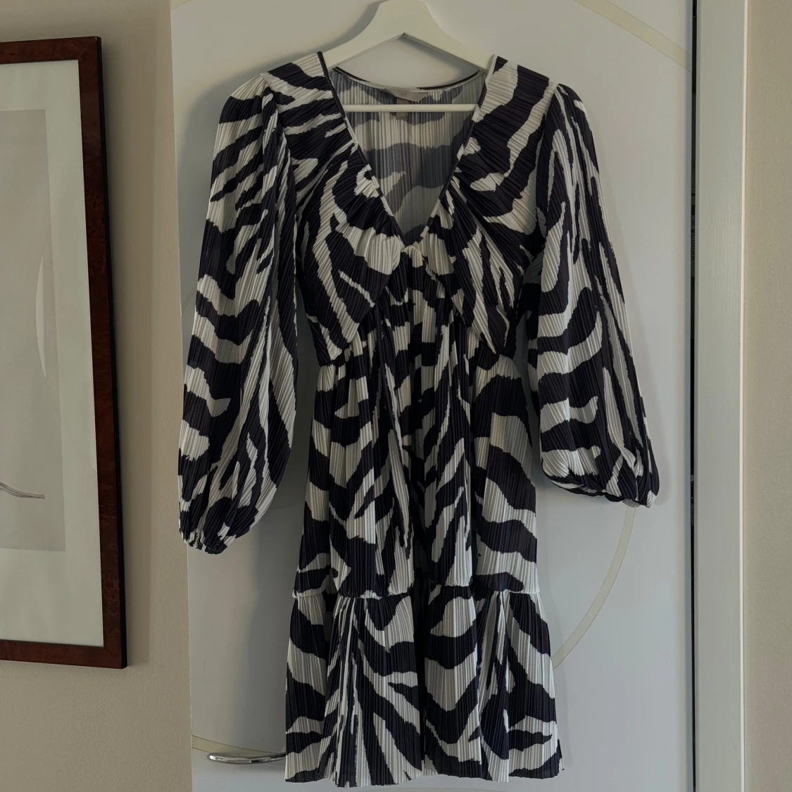 Plisserad klänning från HM