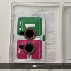 Rosa glittriga ringar - Rosa glitter ringar till kameran. iPhone 12.