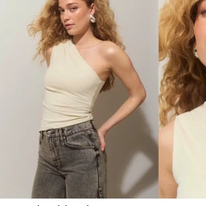 Beige oneshoulder topp - Snygg beige oneshoulder topp, Toppen är andvänd endast 2 gånger så den är i nyskick. Nypris är 330kr