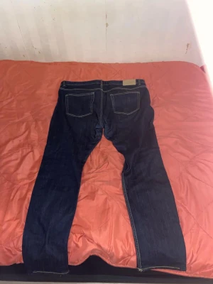 Blåa Jeans - Lite använda den är lite baggy.