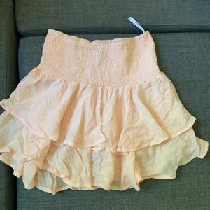 Ljusrosa kjol i storlek L från SHEIN 