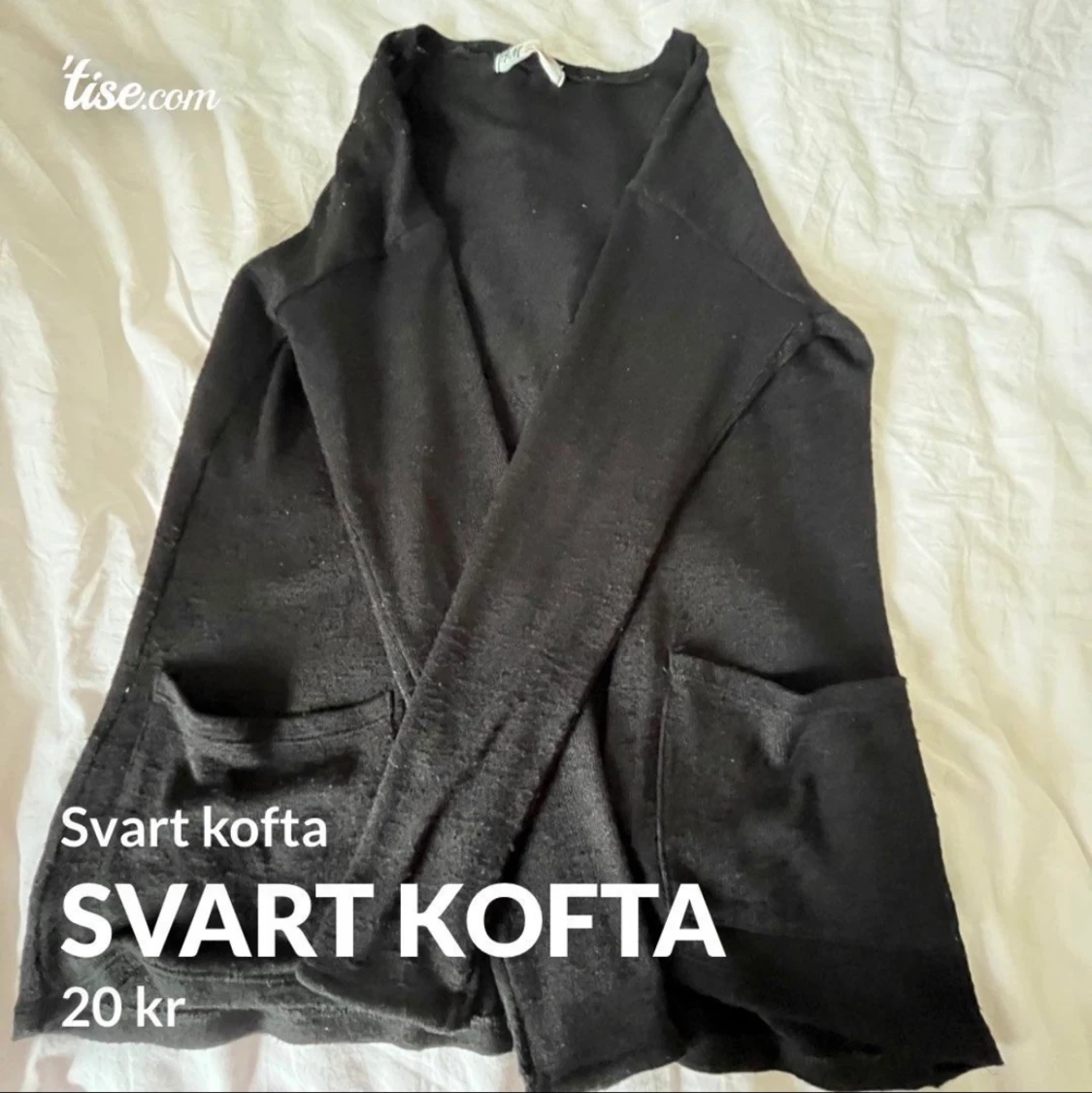 Svart kofta med fickor