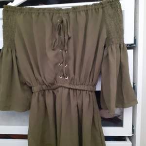 Olive green romper with scrunched detail frontal and back -Size L -sold out style on website New never worn