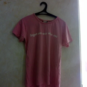 Pink shirt - It is a sign language shirt it makes it easy to communicate with people who can't hear or speak.