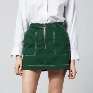 Miniskirt weekday - Svinsnygg kjol från weekday i grönt jeanstyg med stora fickor. För liten för mig :(