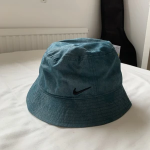 Nike Bucket Hat - Nike blue bucket hat from NittyGritty. I’m not certain if I want to sell. Never worn with tag!