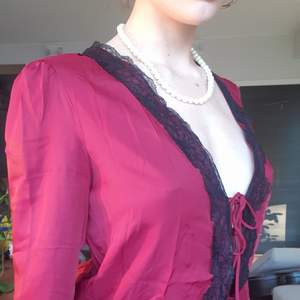 Brand new without tags, silky red top with black lace. 3 ties, so beautiful without a bra on. Size XS