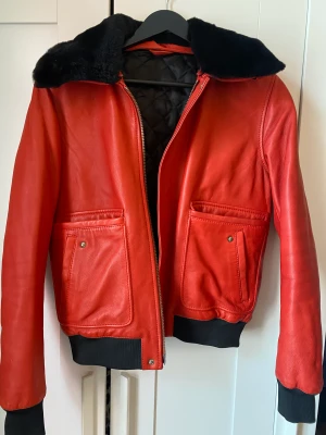 Leather bomber jacket  - Selling this beautiful red leather bomber jacket from J. Lindeberg never worn it size to small for me 