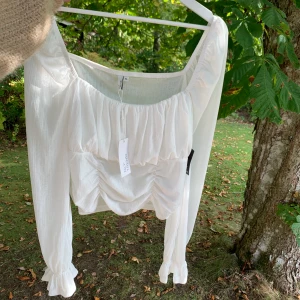 Nelly topp - Aldrig använd, taggen kvar.