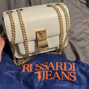 Trussadi beige bag with gold chains as new. 