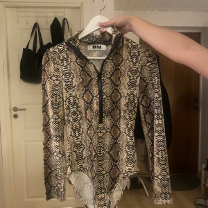 Body - Helt ny body från dm retro aldrig använd.