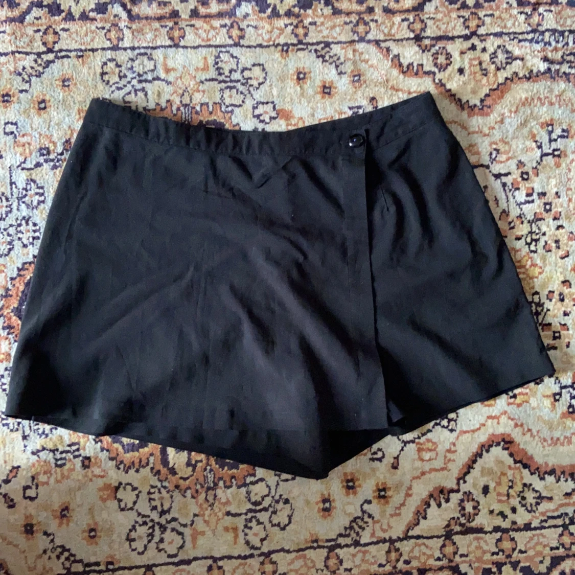 Svart mini-skort storlek 42