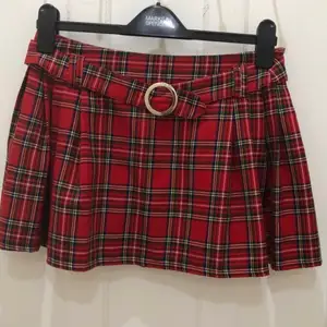 Newlook tartan pleaded skirt in great condition colour red &stripe comes with belt attached to skirt age 13/14 years 