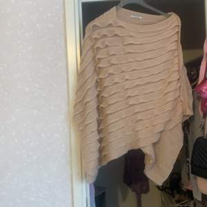 Soft knitted peach coloured poncho by Pieces. Size Small. Never worn.