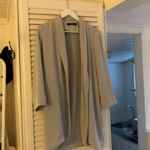 Tunn kappa - Kappa alt kavajliknande plagg